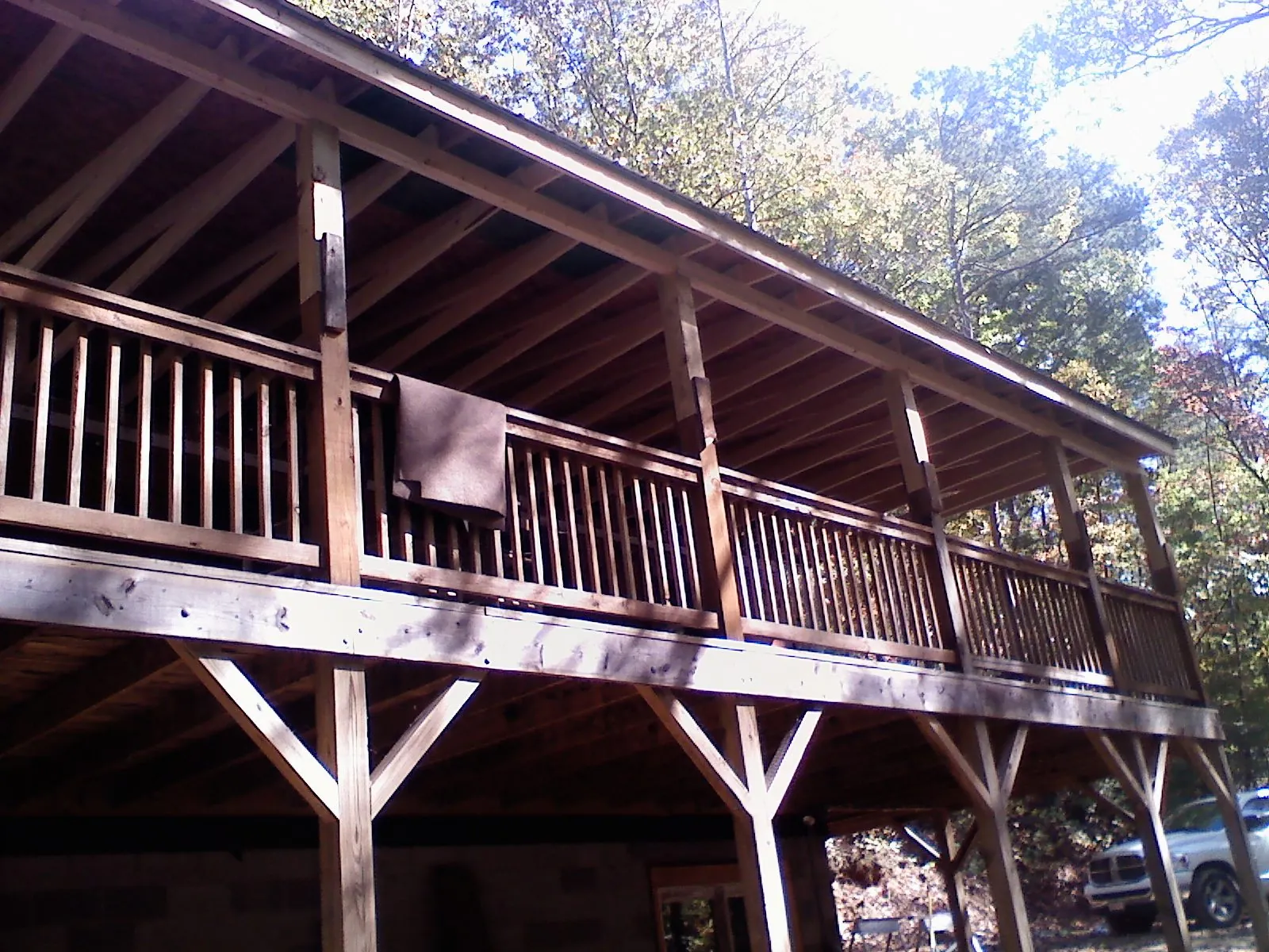 Timber framing under a new elevated porch and deck — Roof Leak Repair in Saint Leonard by Roofing Brothers